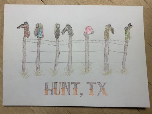 Cowboy Collection Boots on a Fence